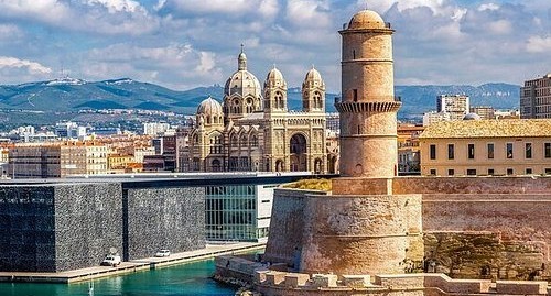 Ancient ruins under a clear sky in the Middle East.